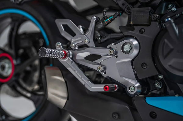 The bike gains CNC racing rearsets